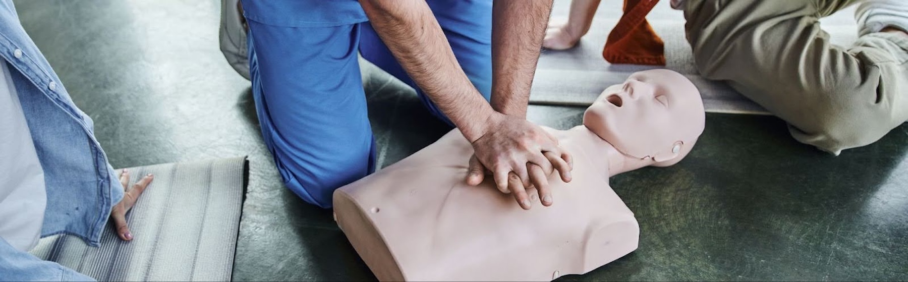 A person practicing CPR.