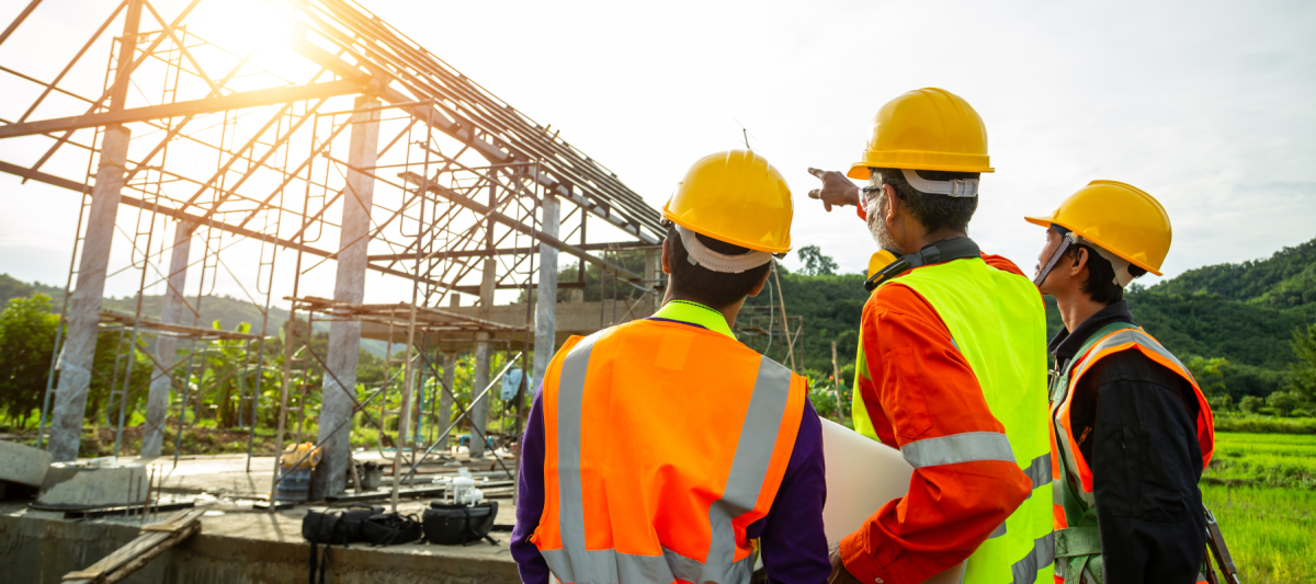 group of diverse construction workers talking about jobsite or worksite
