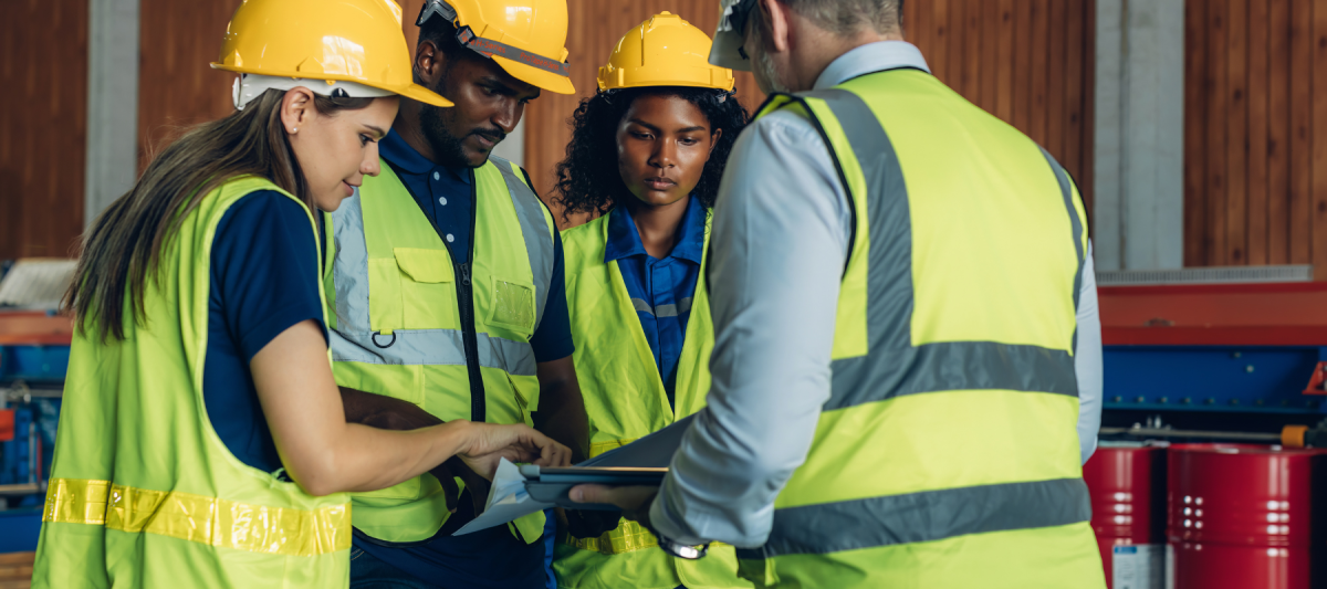 Group of employees talking about workplace safety