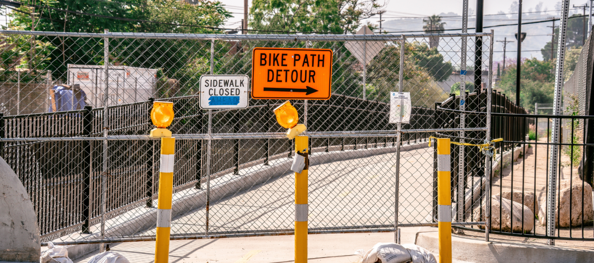 city maintenance work, bridge closed with construction safety cones and signs/postings