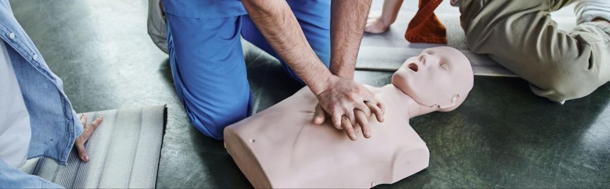 A person practicing CPR.
