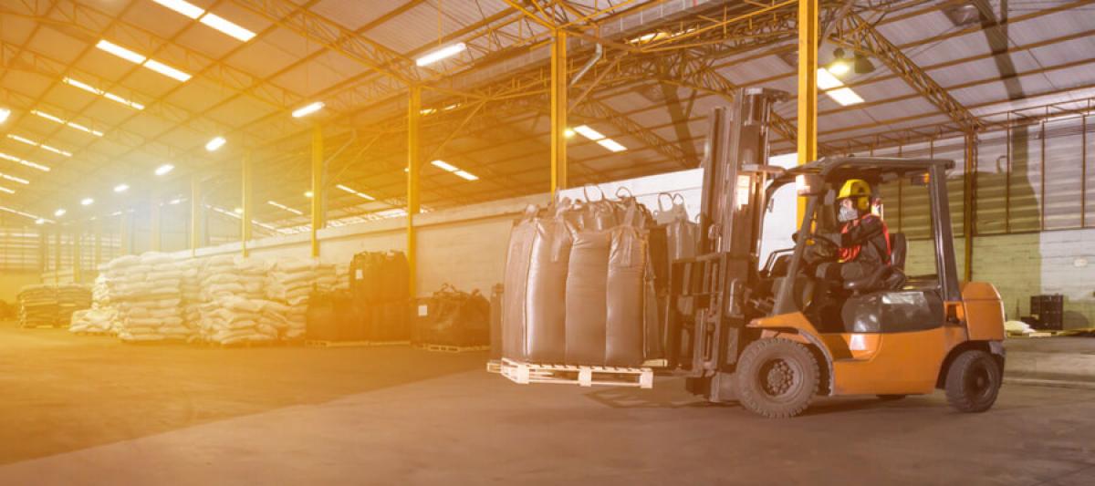 man driving forklift in warehouse, forklift operator