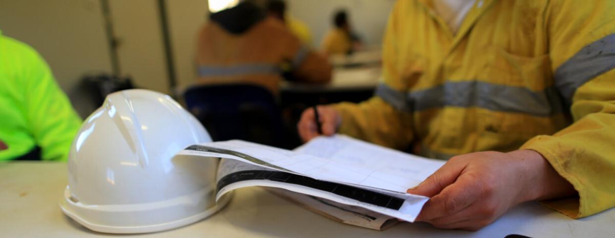 Miner reviewing assessment, msha training at construction mine site